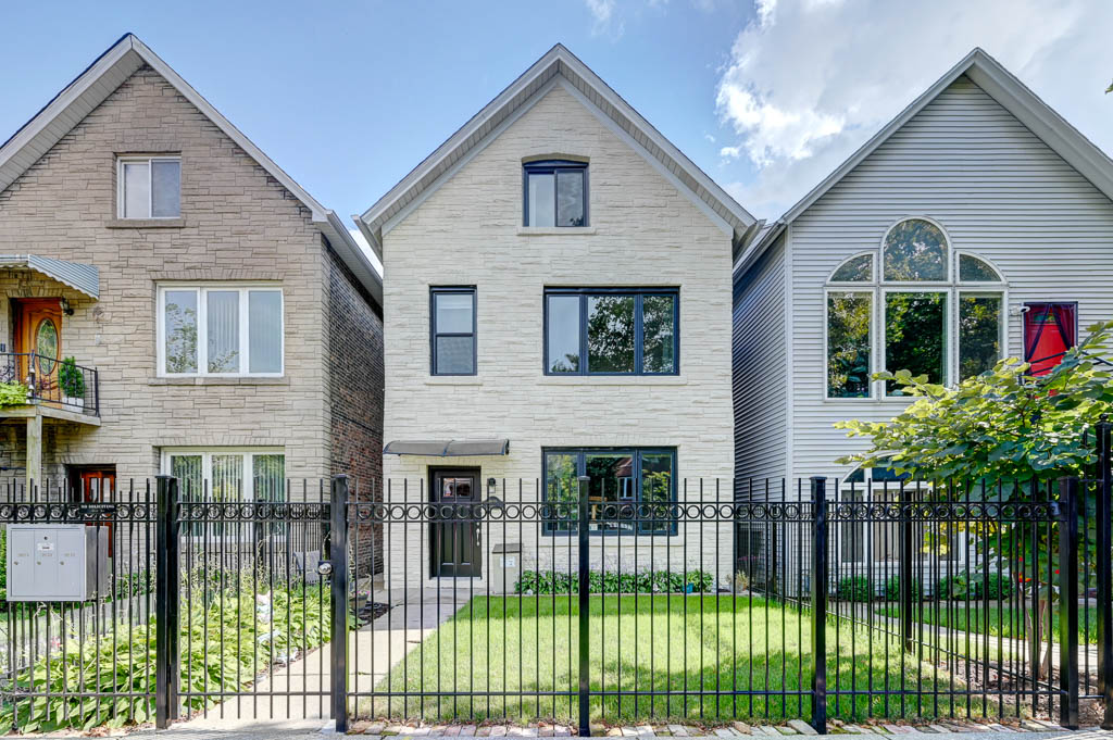 White multi-family home with brack fascade